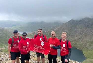 PM Group staff stood at the top of Snowdon