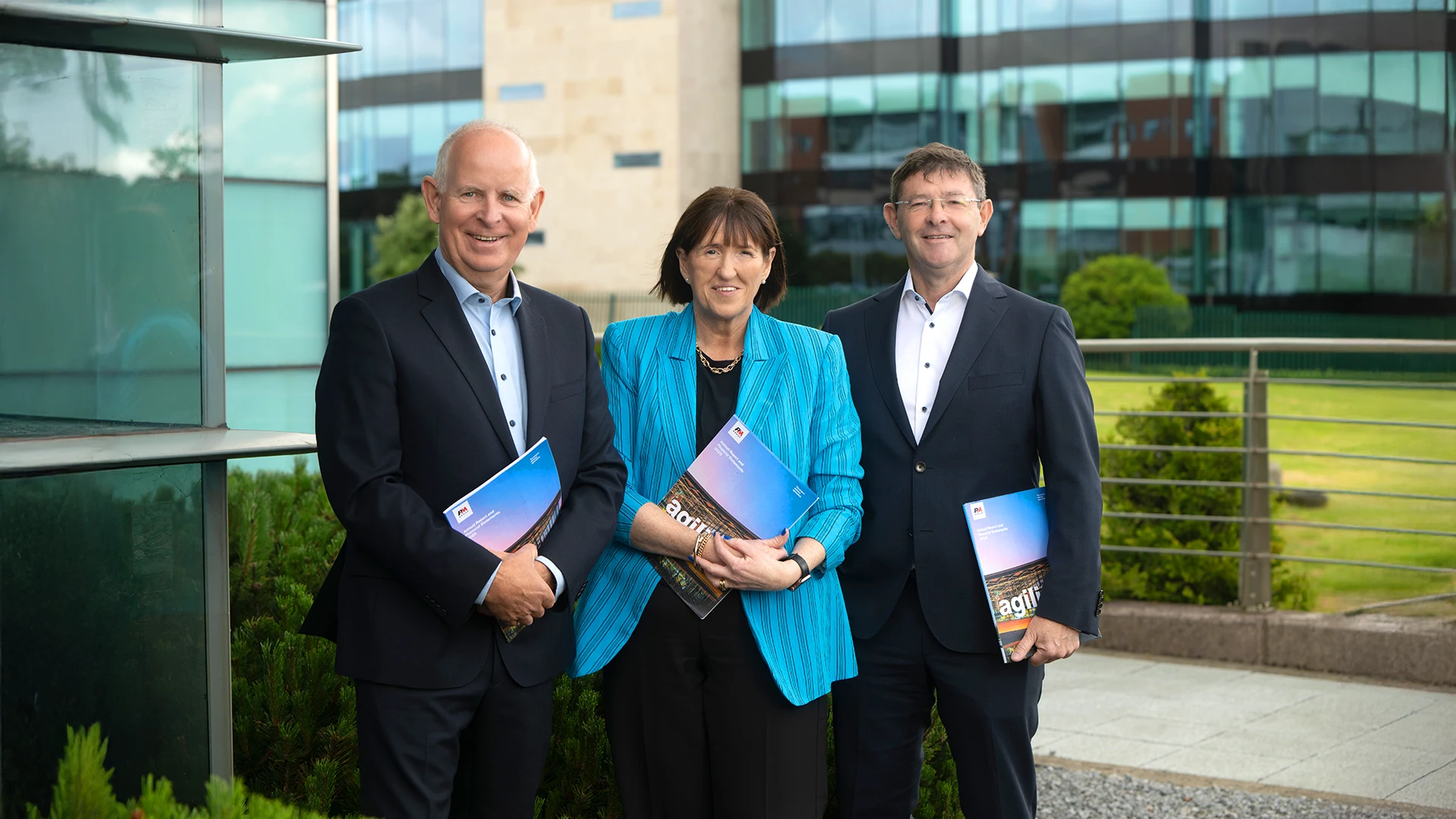 3 people outside office buildings
